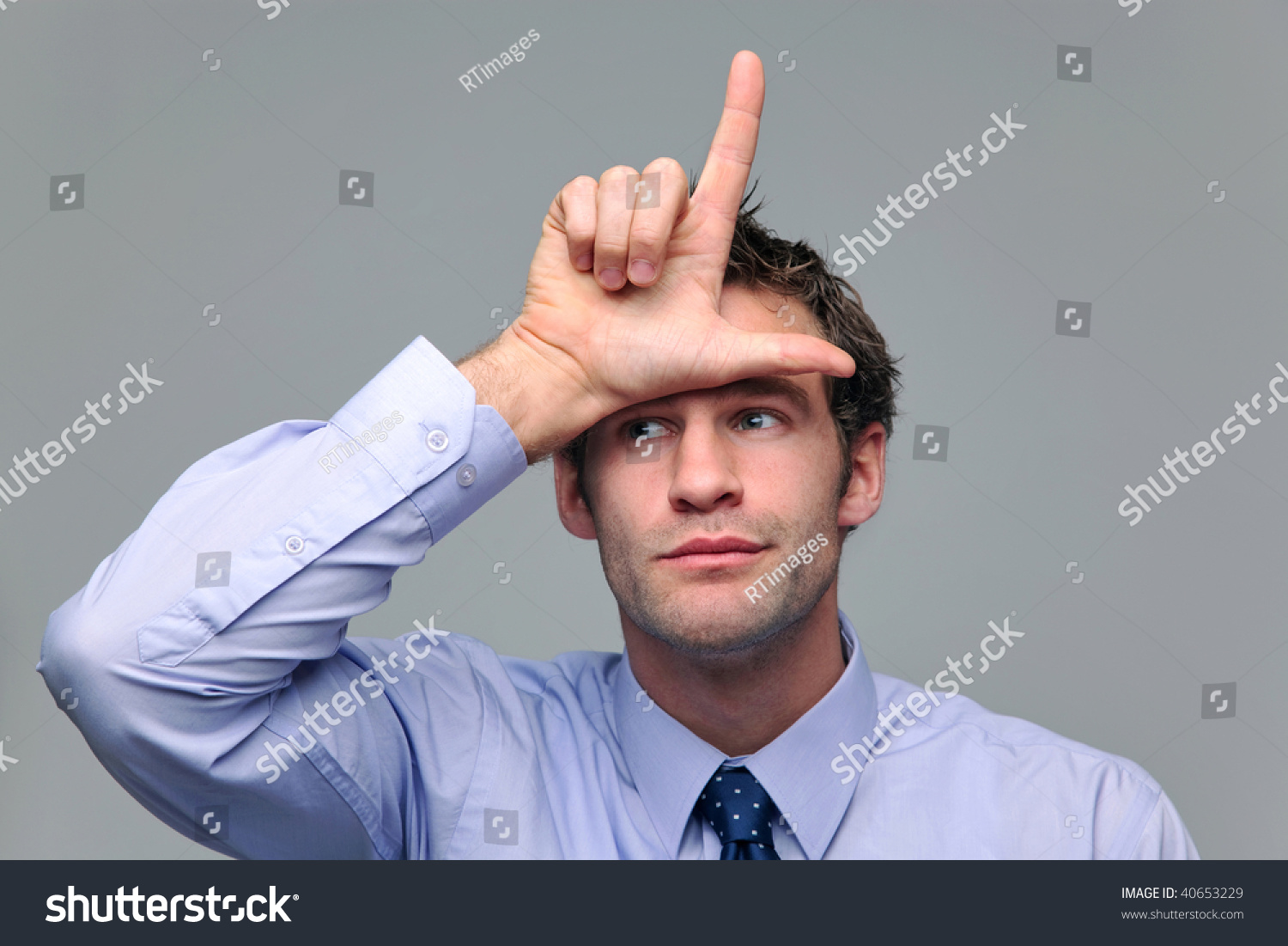 stock-photo-businessman-making-a-loser-gesture-with-his-hand-40653229.jpg