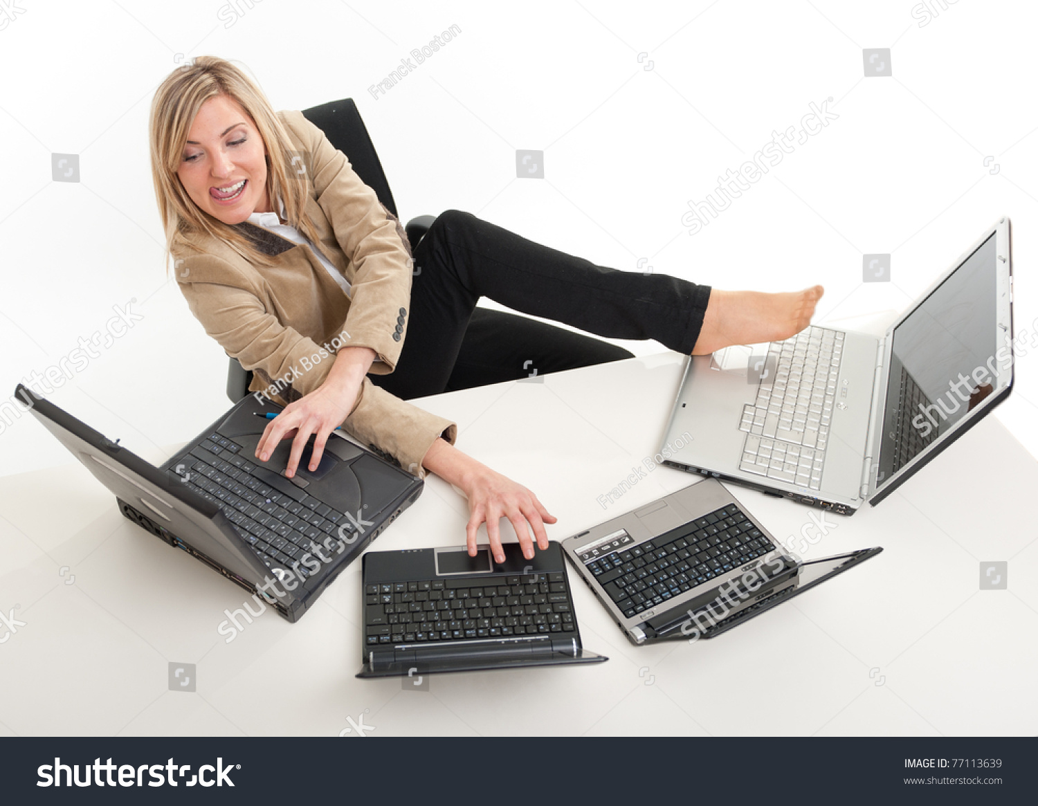 stock-photo-young-women-in-a-desk-overcrowded-with-computers-typing-with-both-hands-and-feet-7...jpg